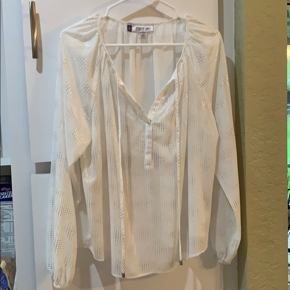 Jennifer Lopez, md, white and silver blouse